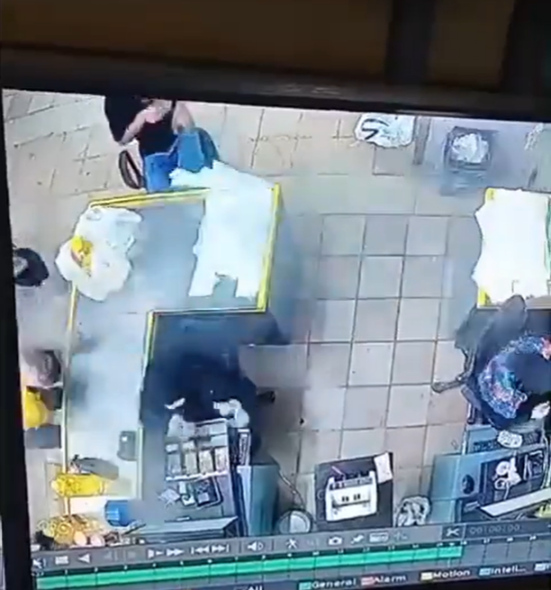 One man (left) was caught on CCTV checking his pager just moments before it blew up