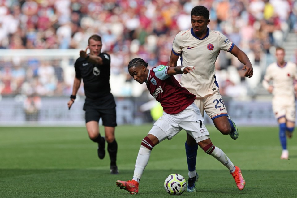 West Ham United's Dutch striker #07 Crysencio Summerville (C) is fouled by Chelsea's French defender #29 Wesley Fofana (R) during the English Premier League football match between West Ham United and Chelsea at the London Stadium, in London on September 21, 2024. (Photo by Adrian Dennis / AFP) / RESTRICTED TO EDITORIAL USE. No use with unauthorized audio, video, data, fixture lists, club/league logos or 'live' services. Online in-match use limited to 120 images. An additional 40 images may be used in extra time. No video emulation. Social media in-match use limited to 120 images. An additional 40 images may be used in extra time. No use in betting publications, games or single club/league/player publications. / (Photo by ADRIAN DENNIS/AFP via Getty Images)