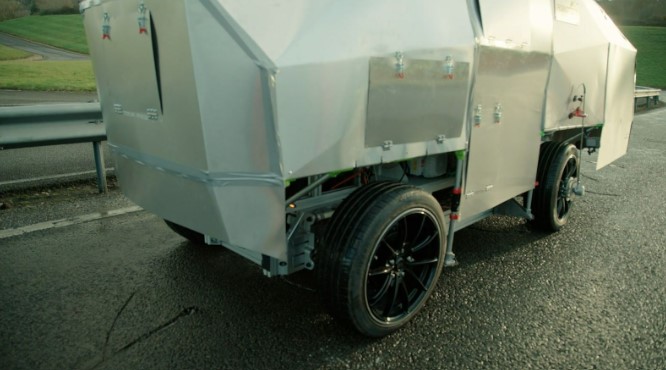 a silver vehicle with a sticker on the side that says ' eec '
