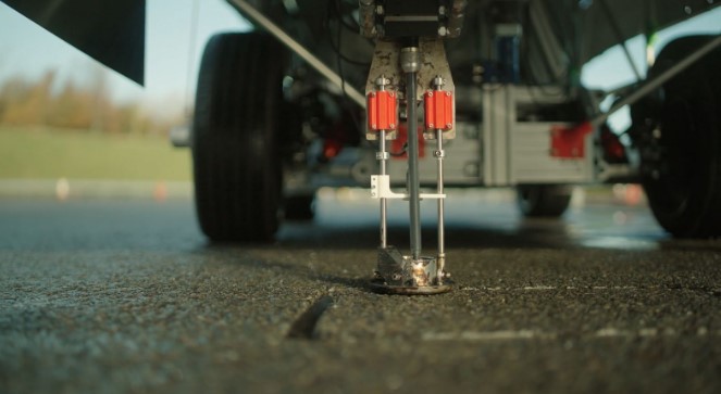 a close up of the bottom of a car with a red x on it