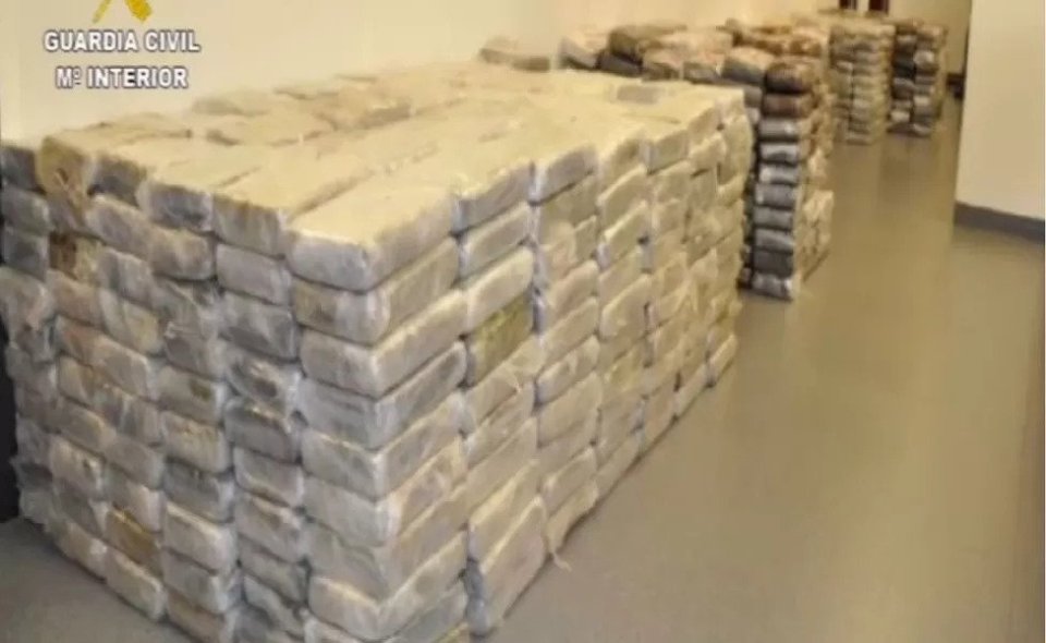 a room filled with lots of bags of drugs stacked on top of each other .