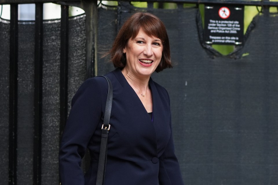 a woman smiles in front of a sign that says this is a protected site