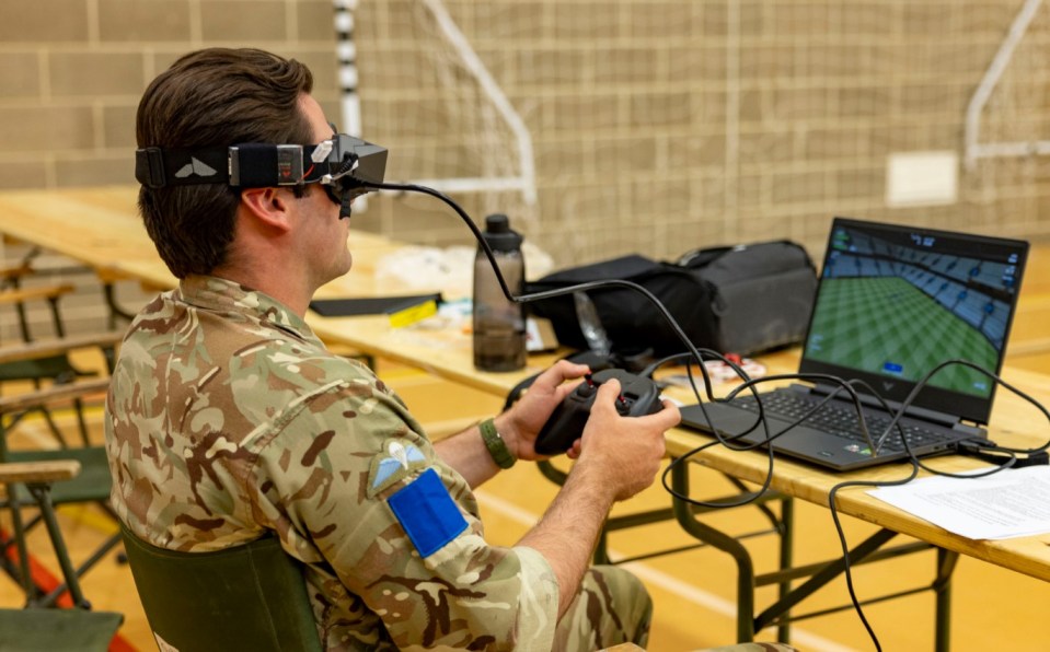 a man in a military uniform is playing a video game