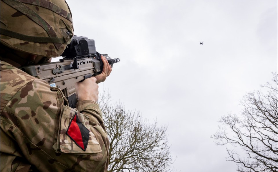 a soldier with a red and black patch on his arm