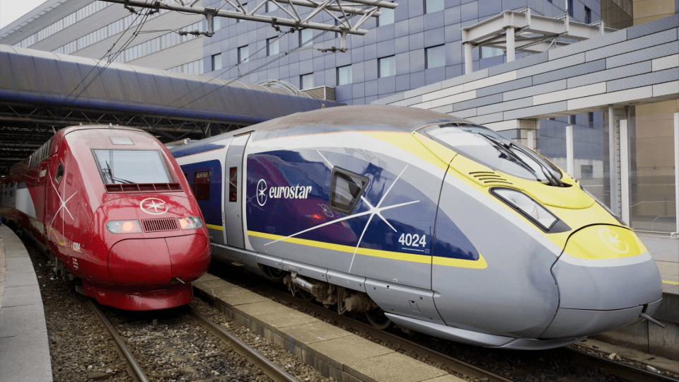 two eurostar trains are parked next to each other