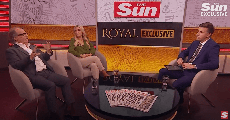 two men and a woman sit at a table in front of a sign that says royal exclusive