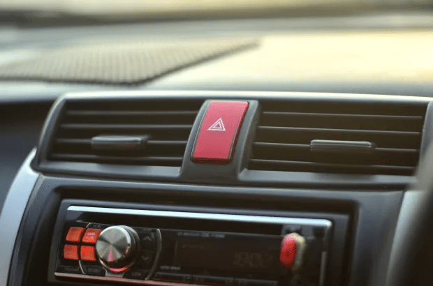 a car radio with a red button that says ' emergency ' on it
