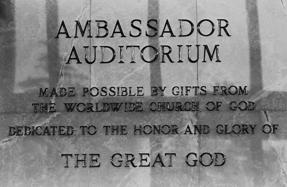 a sign that says ambassador auditorium made possible by gifts from the world wide church of god dedicated to the honor and glory of the great god