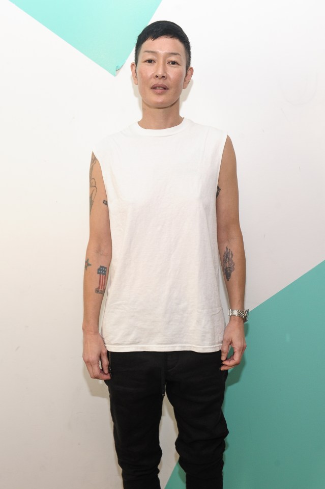 a man with a tattoo of the number 1 on his arm