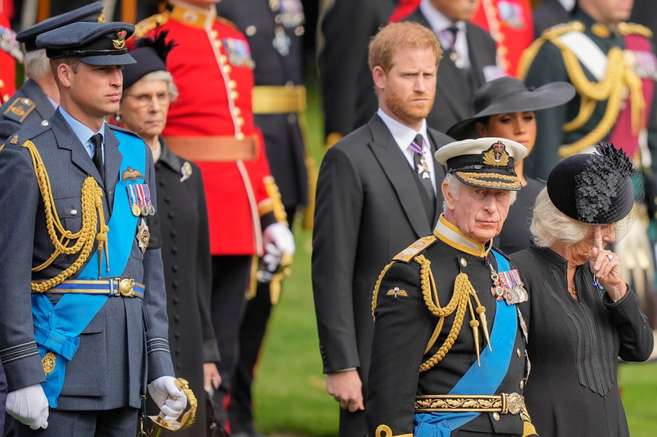 a group of people in military uniforms stand in a line