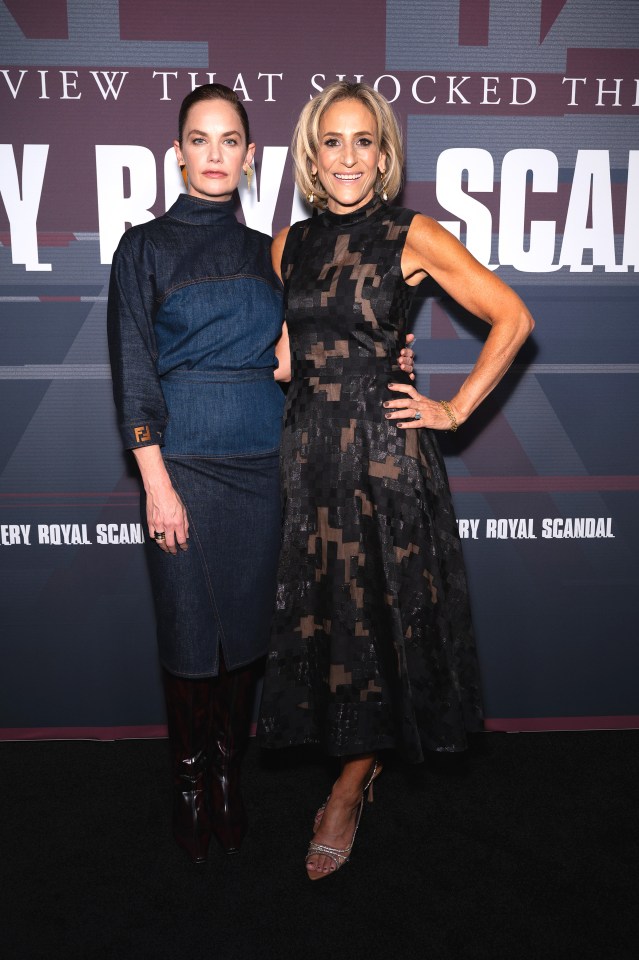 two women standing in front of a sign that says view that shocked the very royal scandal