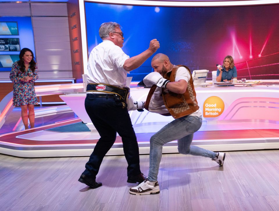 two men are boxing on a good morning britain show
