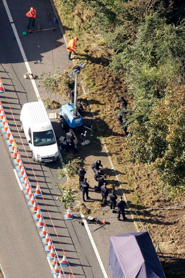 a white van is parked on the side of the road