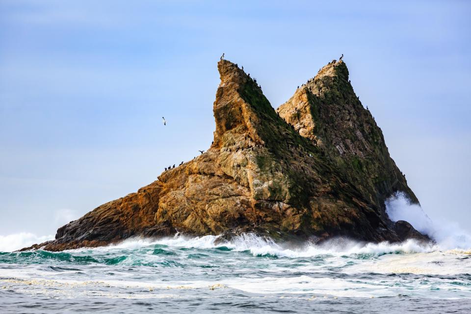 K0P457 Farallon Islands sea stacks off coast of San Francisco in the Gulf of Farallon on a sunny, clear day Also known as the Devil's Teeth