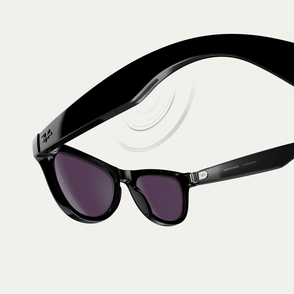 a pair of ray-ban sunglasses with purple lenses