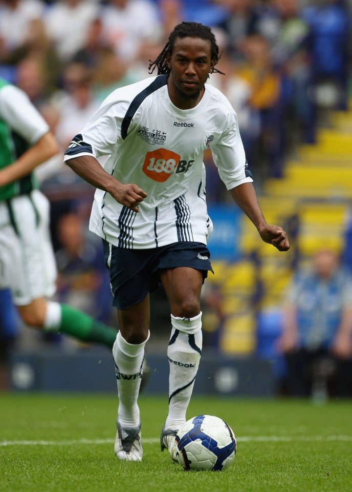 a soccer player wearing a white jersey with 188 bf on it