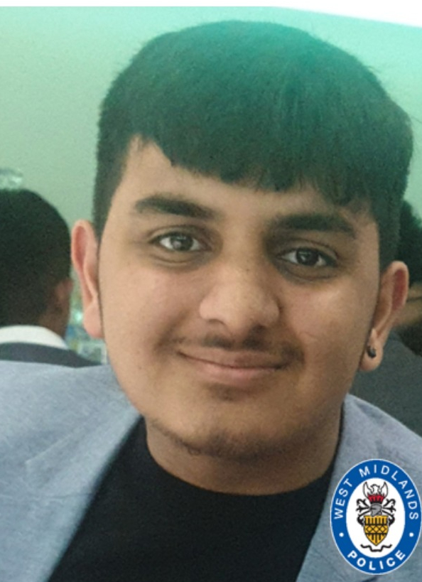 a young man with a west midlands police logo on his shirt