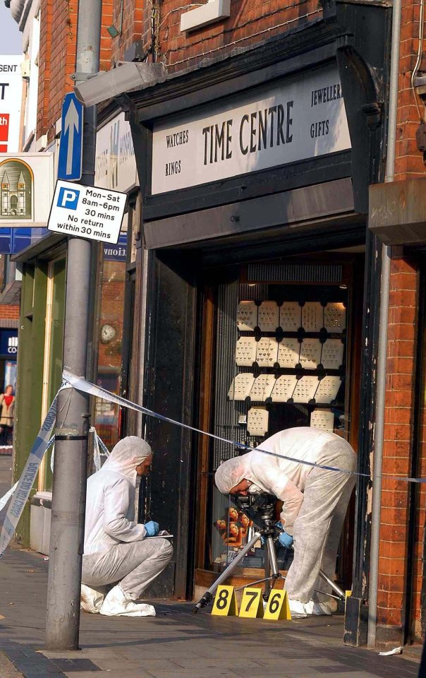 a store front with a sign that says time centre