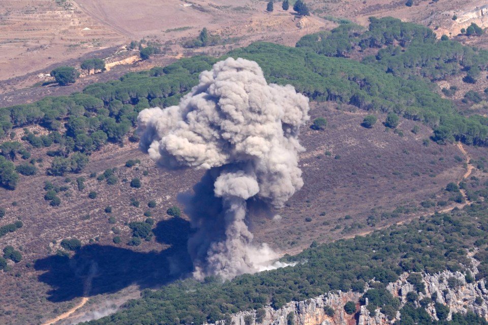 a large cloud of smoke is coming out of the ground