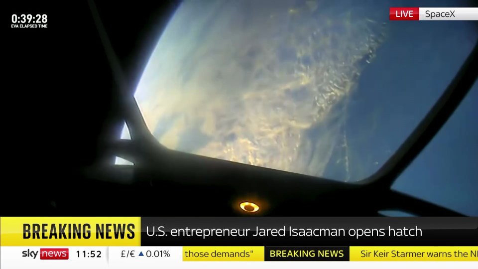 a breaking news screen shows us entrepreneur jared isaacman opening hatch