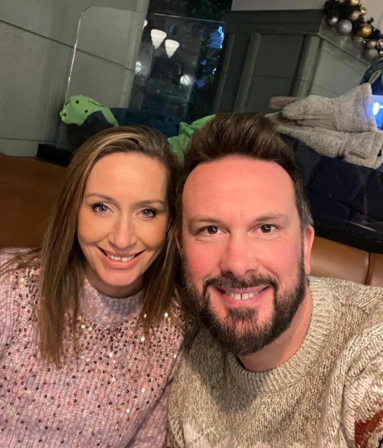 a man and a woman are posing for a picture together