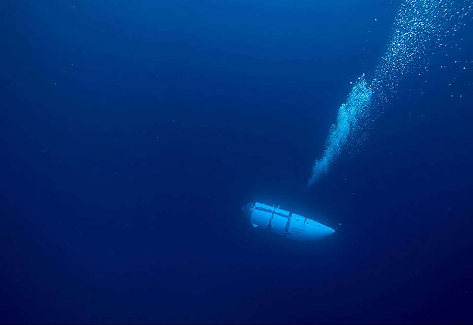 a boat is floating in the ocean with bubbles coming out of it