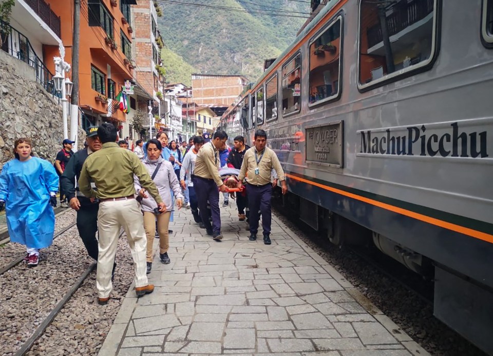 a train that says machu picchu on the side of it