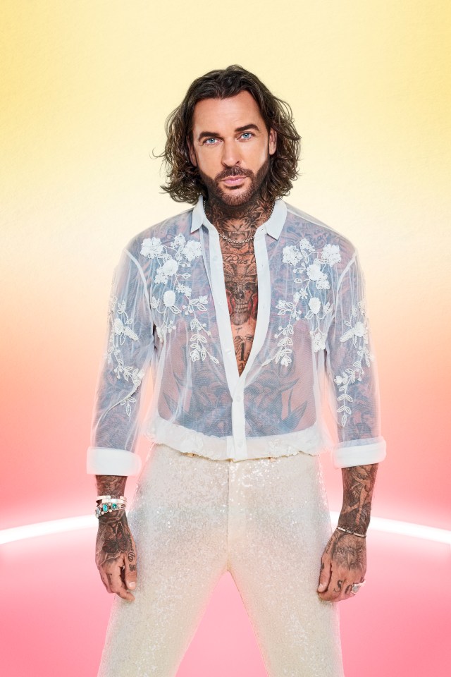 a man with a beard is wearing a white shirt and white pants