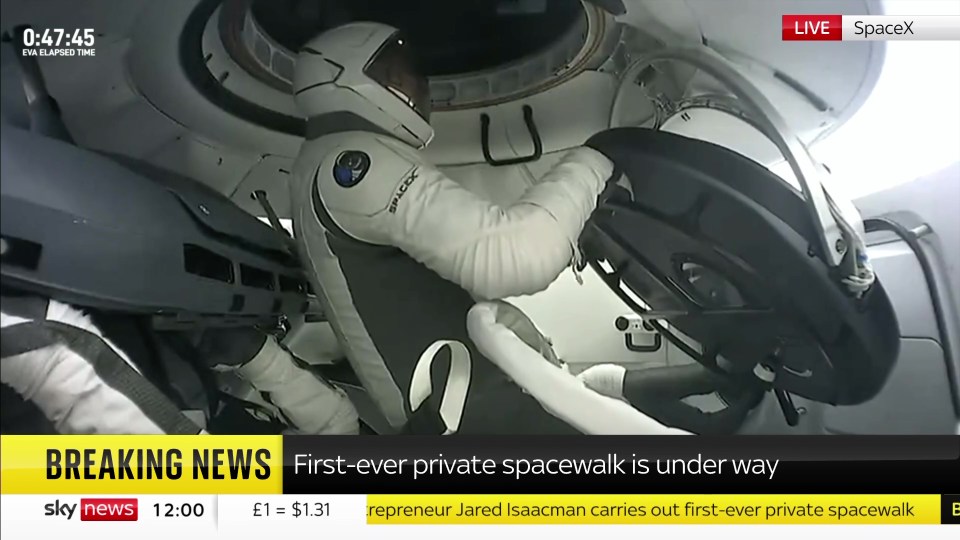 a breaking news screen shows the first ever private spacewalk is underway