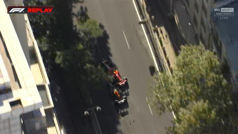 an aerial view of a race car driving down a street .