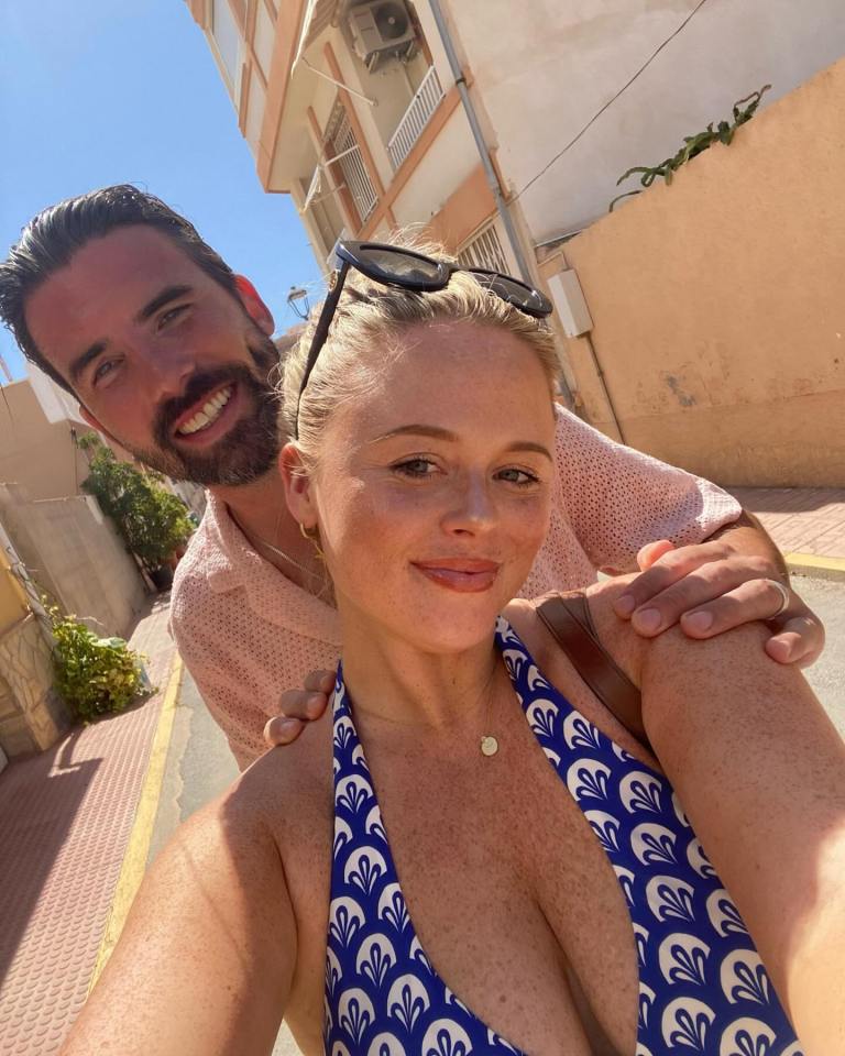 a man and a woman are posing for a picture