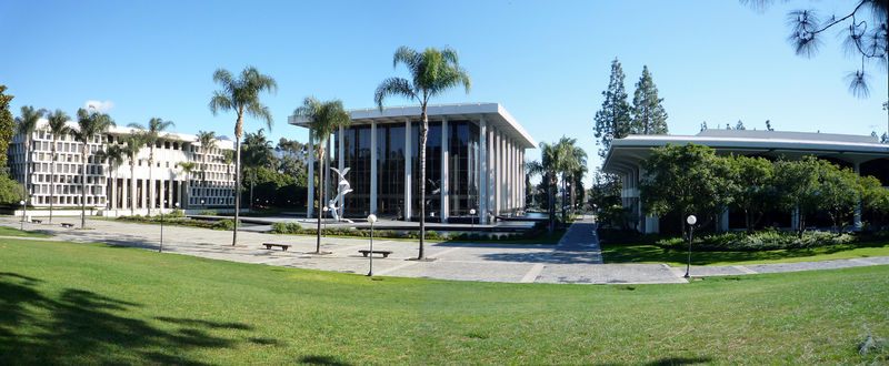 a large white building with a fountain in front of it