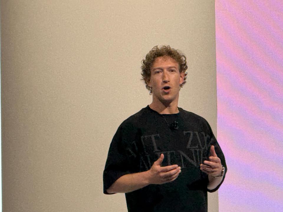 a man wearing a black t-shirt that says ' it ' on it