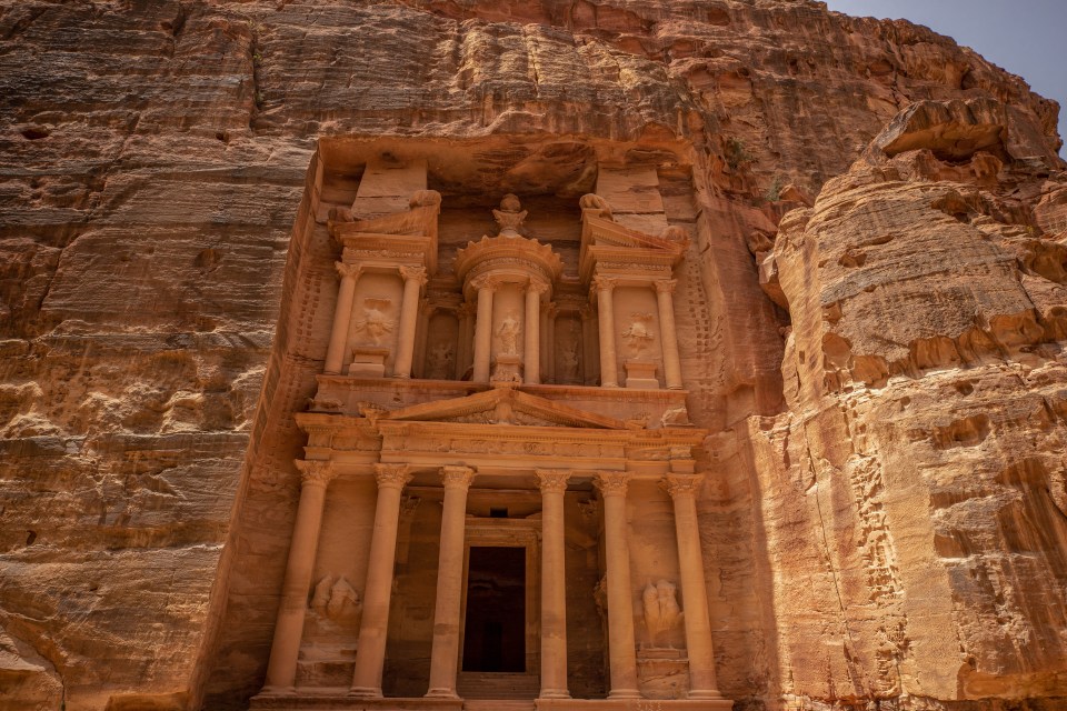 a large stone building with the word petra carved into it