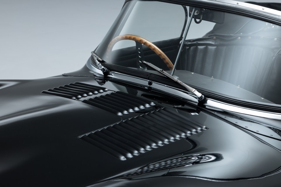 a close up of the hood of a black car