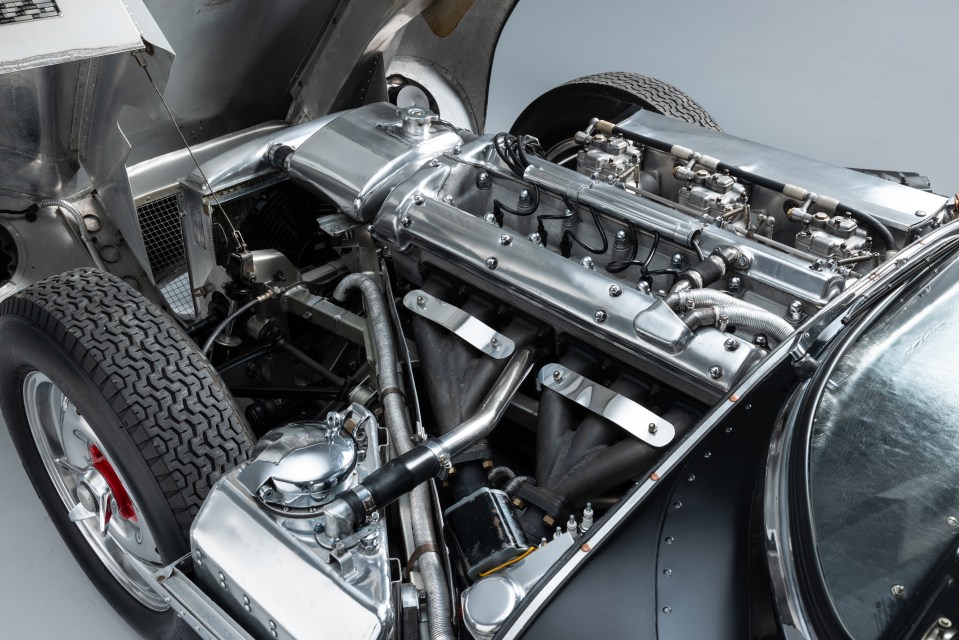 a close up of a car engine with the hood open