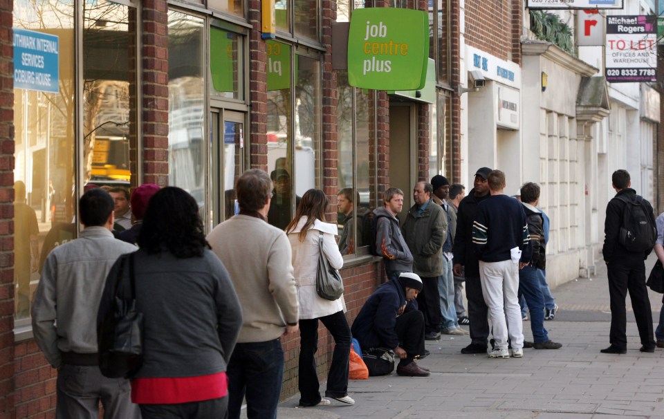 a line of people waiting outside a job centre plus