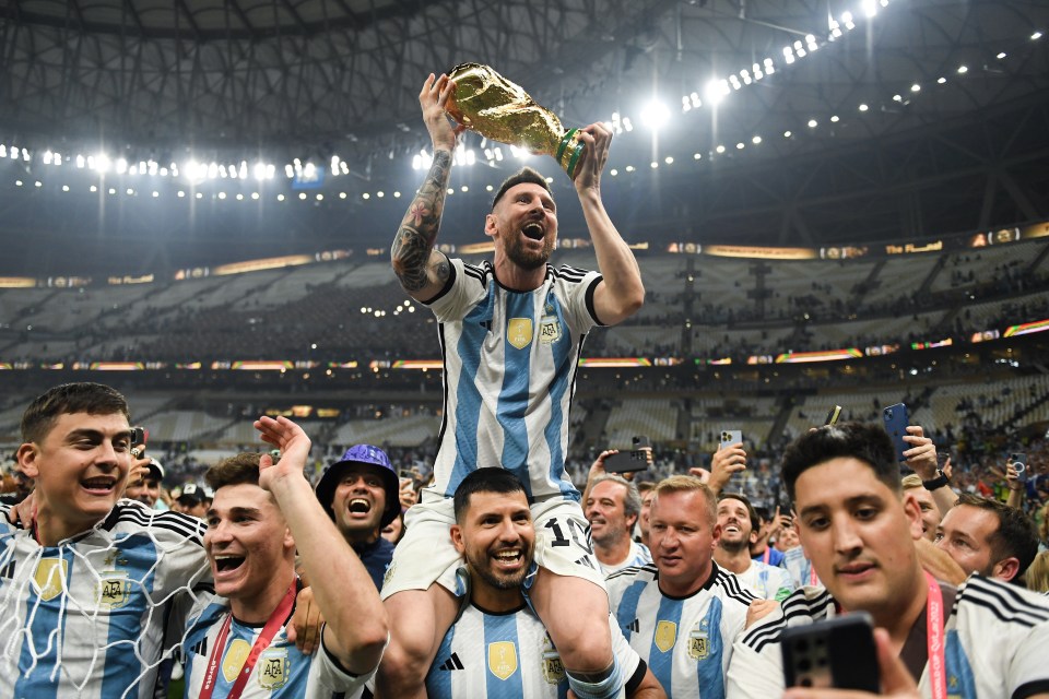 a soccer player holding a trophy with the number 10 on his back