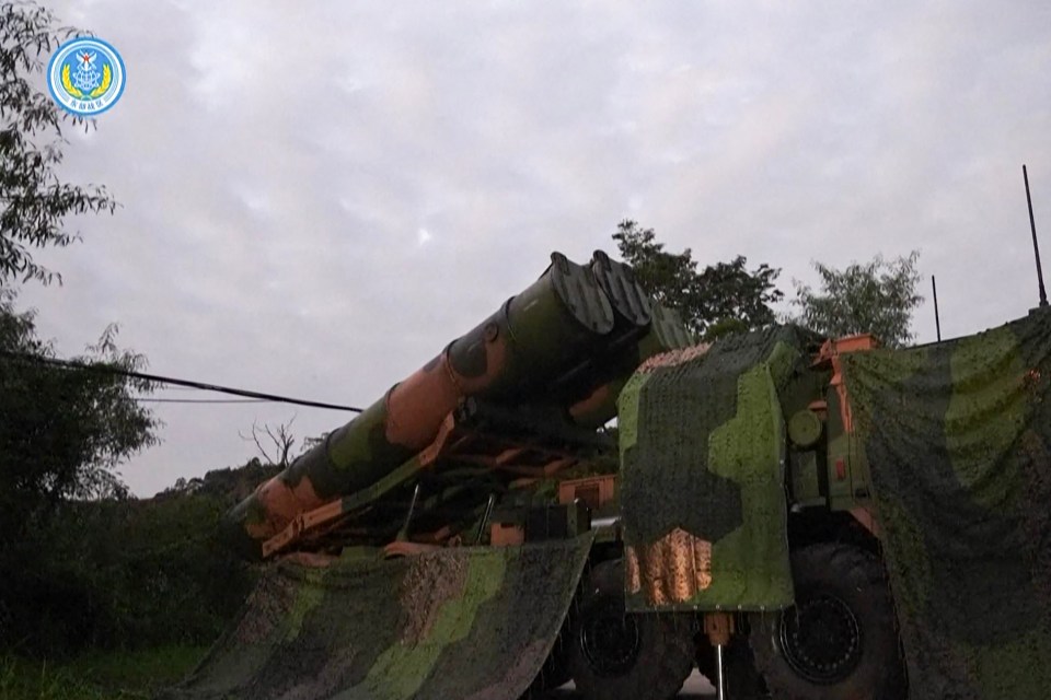 a camouflaged military vehicle with a blue circle that says ' sss ' on it