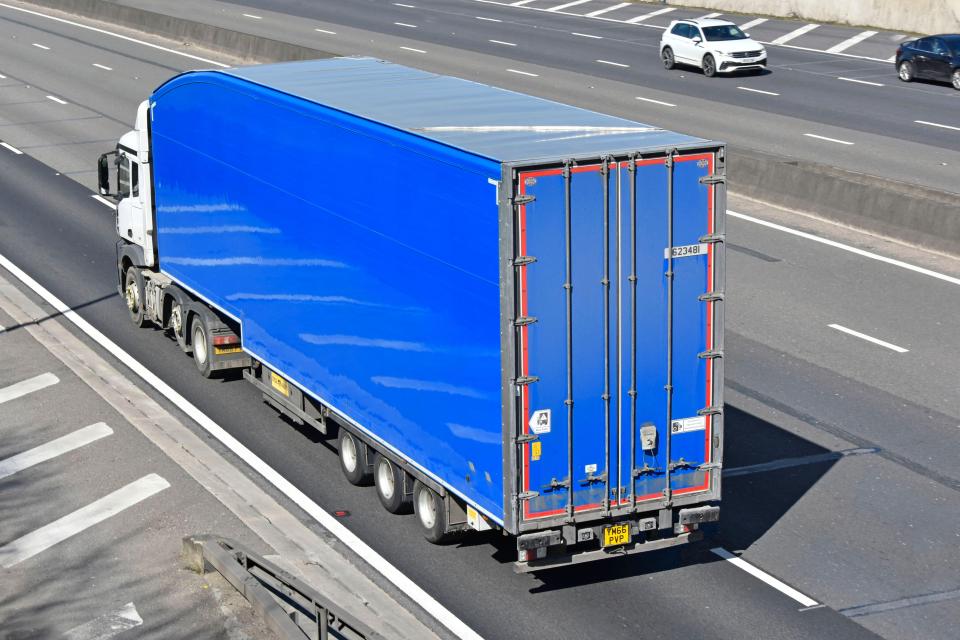 a blue semi truck with a license plate that says jds