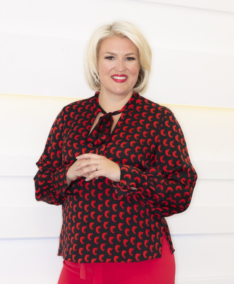 a woman wearing a red and black blouse with a bow