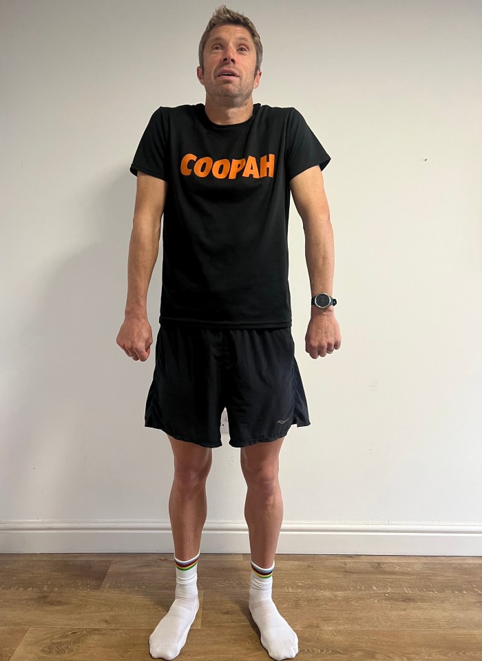 a man wearing a black t-shirt that says coopah