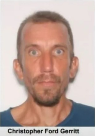 a man with a beard and mustache is wearing a blue shirt .