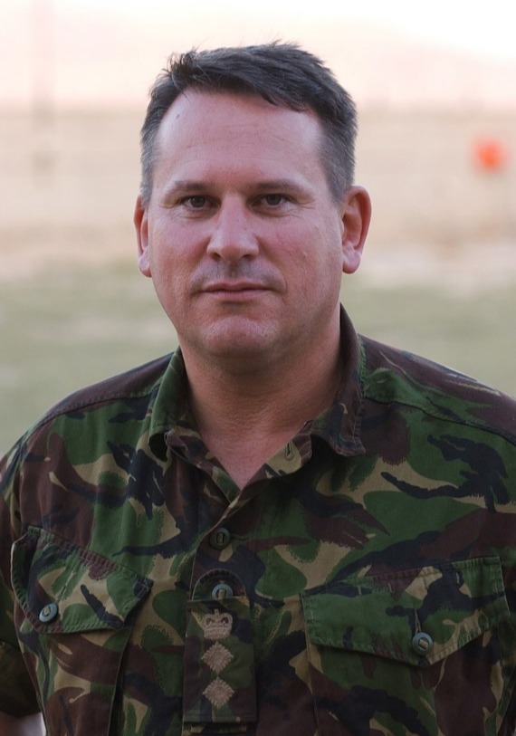 a man in a camouflage shirt has the word army on his chest