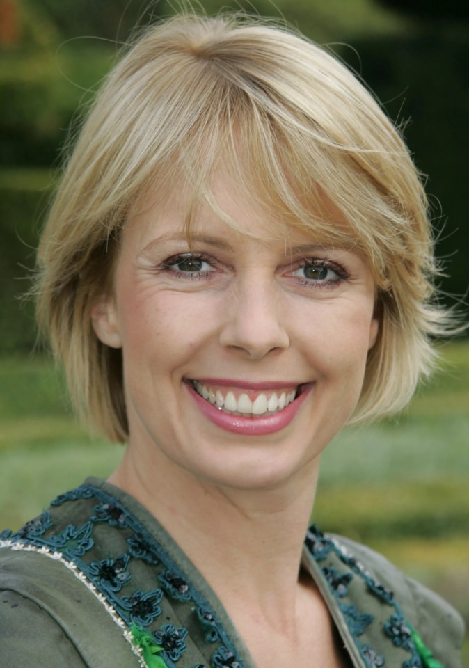 a woman with short blonde hair is smiling for the camera