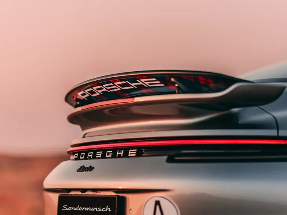 the rear end of a porsche turbo is shown