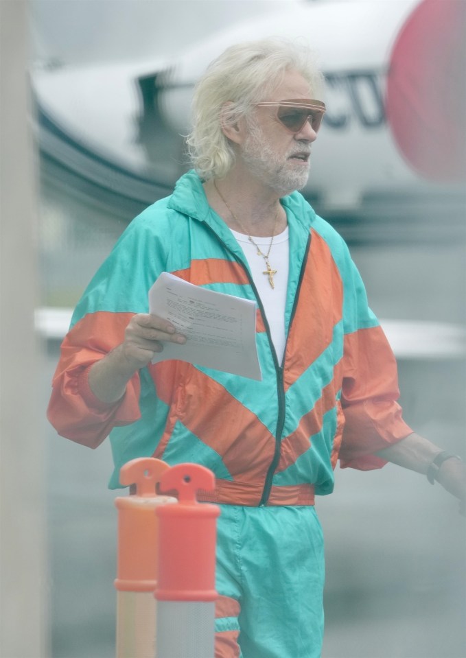 BGUK_3071946 - *EXCLUSIVE* Gold Coast, AUSTRALIA - WEB MUST CALL FOR PRICING - STRICTLY NOT AVAILABLE FOR DAILY MAIL ONLINE USAGE - Sir Bob Geldof looks over his lines for his part in a zombie plane movie being filmed at Gold Coast Airport.....Pictured: Sir Bob Geldof....BACKGRID UK 28 OCTOBER 2024 ....*STRICTLY NOT AVAILABLE FOR MAIL ONLINE*....UK: +44 208 344 2007 / uksales@backgrid.com....USA: +1 310 798 9111 / usasales@backgrid.com....*Pictures Containing Children Please Pixelate Face Prior To Publication*