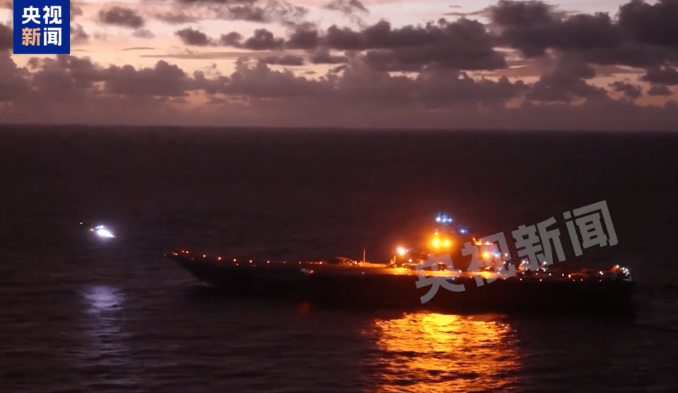 a large ship in the ocean with chinese writing on the bottom