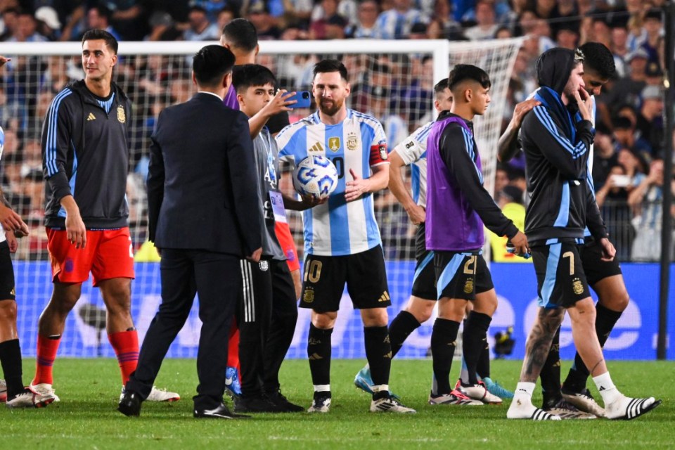 BUENOS AIRES, ARGENTINA - OCTOBER 15: Lionel Messi of Argentina takes the match ball after scoring a hat-trick during a FIFA World Cup 2026 Qualifier match between Argentina and Bolivia at Estadio Más Monumental Antonio Vespucio Liberti on October 15, 2024 in Buenos Aires, Argentina. (Photo by Rodrigo Valle/Getty Images)