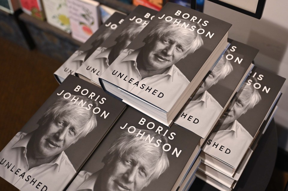 a stack of books titled boris johnson unleashed